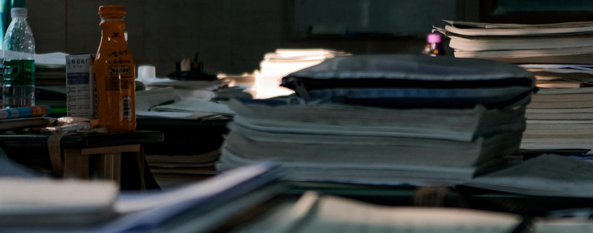 Piles of papers on a desk