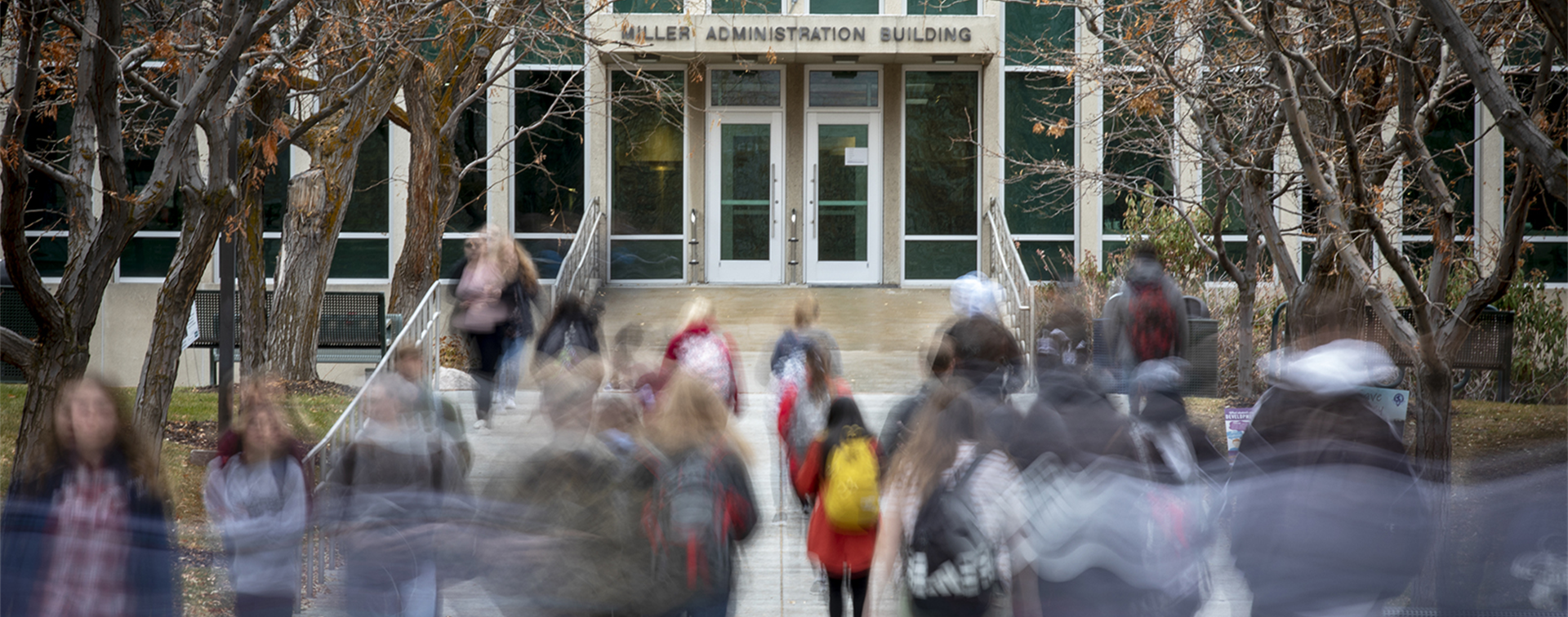 Long exposure image of students walking on Weber State's campus.