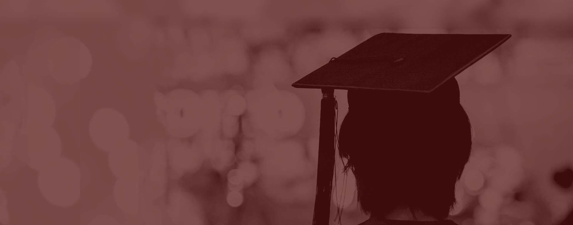 Picture of a woman in a graduation cap.