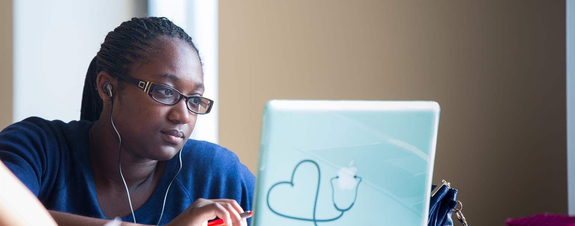 Student looking at a laptop